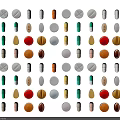 Medical Devices Featuring Pills in Various Colors and Different Shapes Arranged on Black Background