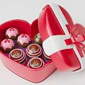 Open Red Heart Shaped Box Containing Decorated Cupcakes And Ribbon Bow