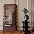 Wooden Framed Wavy Floor Mirror With Black Winged Sculpture And Decorative Wall