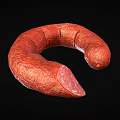 Red Curved Sausage With Sliced End Exposed Meat Texture On Black Background