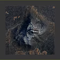 Aerial View of Snow Capped Volcano with Reddish Brown Terrain and Surrounding Landscape