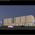 Modern Industrial Factory Building With Large Glass Facade Illuminated At Night And Cars Passing By