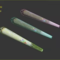 Three Conical Decorative Items With Green White Surface And Colorful Patterns