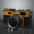 Vintage Nikon Electronic Camera With Yellow And Black Body And Lens