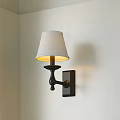 Modern Wall Lamp With White Fabric Shade And Black Metal Base For Home Lighting