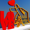 Red LOVE And Yellow Hand Sculpture Photo Spot With Pointing Red Heart And Inscribed Text