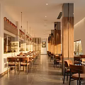 Modern Restaurant Interior With Wooden Tables Chairs Hanging Pendant Lights Wall Art And Tiled Floor