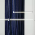 Modern Linear Pendant Light With Sleek Metal Frame Against Navy Blue Curtains And White Background