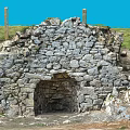 Microtopography Featuring Stone Wall Structure With Arched Entrance And Natural Terrain