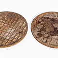 Road Infrastructure Circular Manhole Covers With Grid Pattern And Worn Stained Surface 3d model