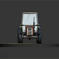 Old Orange Green Tractor Model With Large Tires On Green Circular Base
