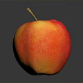 Fresh Ripe Red and Yellow Apple with Stem on Reflective Dark Surface