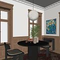 Elegant Restaurant Interior With Round Black Dining Table Green Plant And Colorful Floral Painting