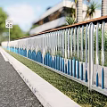 Modern Metal Fence With Blue And White Pattern Along Roadside Grass And Building Background