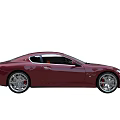 Red Maserati Coupe Sports Car With Sleek Body And Sporty Alloy Wheels