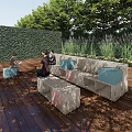 Outdoor Chair On Wooden Decking With Green Hedge And People Sitting Comfortably