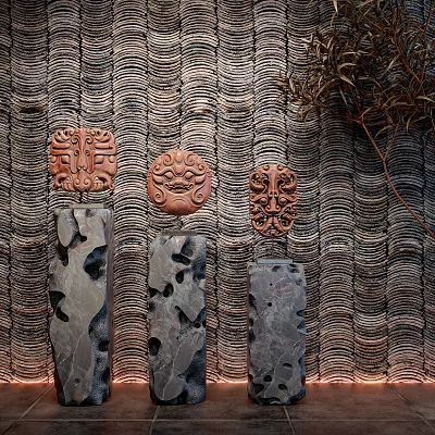 Artistic Sculpture Carvings Featuring Intricate Masks And Perforated Stone Slabs On Textured Wavy Wall 3d model