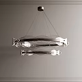 Modern Metallic Chandelier Featuring Circular Geometric Structure And Sleek Design Elements