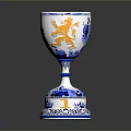 Intricate Sculpted Ceramic Goblet With Blue White Patterns And Orange Lion Design