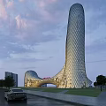 Modern Office Building With Unique Glass Facade Streamlined Design And Golden Sunset Glow Surrounded By Greenery
