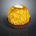 Delicious Chocolate In Golden Foil Wrapping With Label On Brown Wavy Paper Cup