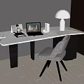 Modern Desk with White Marble Top Laptop Lamp Books Photo Frame and Grey Upholstered Chair