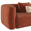 Brown Velvet Sectional Sofa With Multiple Cushions Ottoman And Striped Blanket