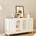 White Modern Sideboard With Glass Doors And Decorative Vase Photo Frames Fruit Figurine