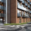 Modern Residential Building With Red Brick Exterior And Balconies In Paved Courtyard