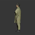 Man Wearing Green Kimono With Red Belt Standing With Hands On Chest Against Gray Background