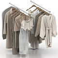Stylish Assorted Clothes on Hangers with Robes Dresses and Coats in Neutral Tones
