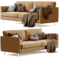 Modern Tan Two Seater Sofa With Plush Pillows And Cozy Blanket