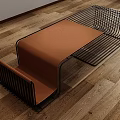 Sleek Modern Coffee Table With Black Metal Wire Frame And Orange Cushioned Top