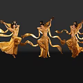 Three Female Dancers With Elaborate Headpieces In Golden Costumes Dancing With Flowing Ribbons