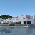 Industrial Factory Complex With Multiple Buildings Green Hills And Water Area
