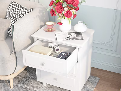 White Nightstand With Open Drawer Camera Book Red Flowers Vase Small Teacup And Magazine 3d model