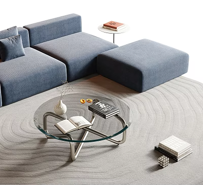 Glass Top Coffee Table With Metal Legs Near Blue Sofa And Ottoman On Wavy Rug 3d model