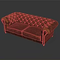Classic Red Tufted Sofa With Ornate Armrests And Detailed Stitching