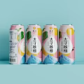 Four Colorful Prince Walnut Beverage Cans Arranged on Light Blue Background