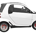 White Compact Car With Black Roof Red Alloy Wheels And Two Door Design