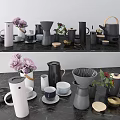 Stylish Modern Tea Set Collection With Ceramic Teapots Cups And Fresh Flowers On Marble Countertop