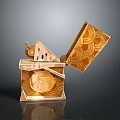 Golden Decorative Storage Box Featuring Open Lid And Intricate Coin Patterns