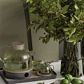 Stylish Kitchenware Display With Glass Teapot Green Plant And Wooden Cutting Boards