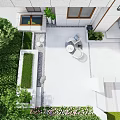 Courtyard Garden Design With White Paving Round Table Chairs Green Plants And Flowers