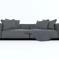 Modern Gray Two-Seater Sofa with Soft Pillows and Cozy Blanket Design