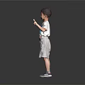 Little Boy In Gray Background Wearing White T-shirt Gray Shorts Blue Sneakers And Peace Sign