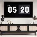 Modern Black TV Stand with Decorative Statue Deer Figurine Vase and Potted Plant in Living Room Interior