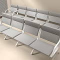 Multiple Rows of Gray Public Chairs with Metal Frames in Indoor Waiting Area