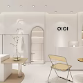 OIOI Clothing Store Interior With White Decor Arched Doorway Display Shelves And Chair