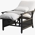 Comfortable White Cushioned Lounge Chair With Black Wicker Frame And Ottoman